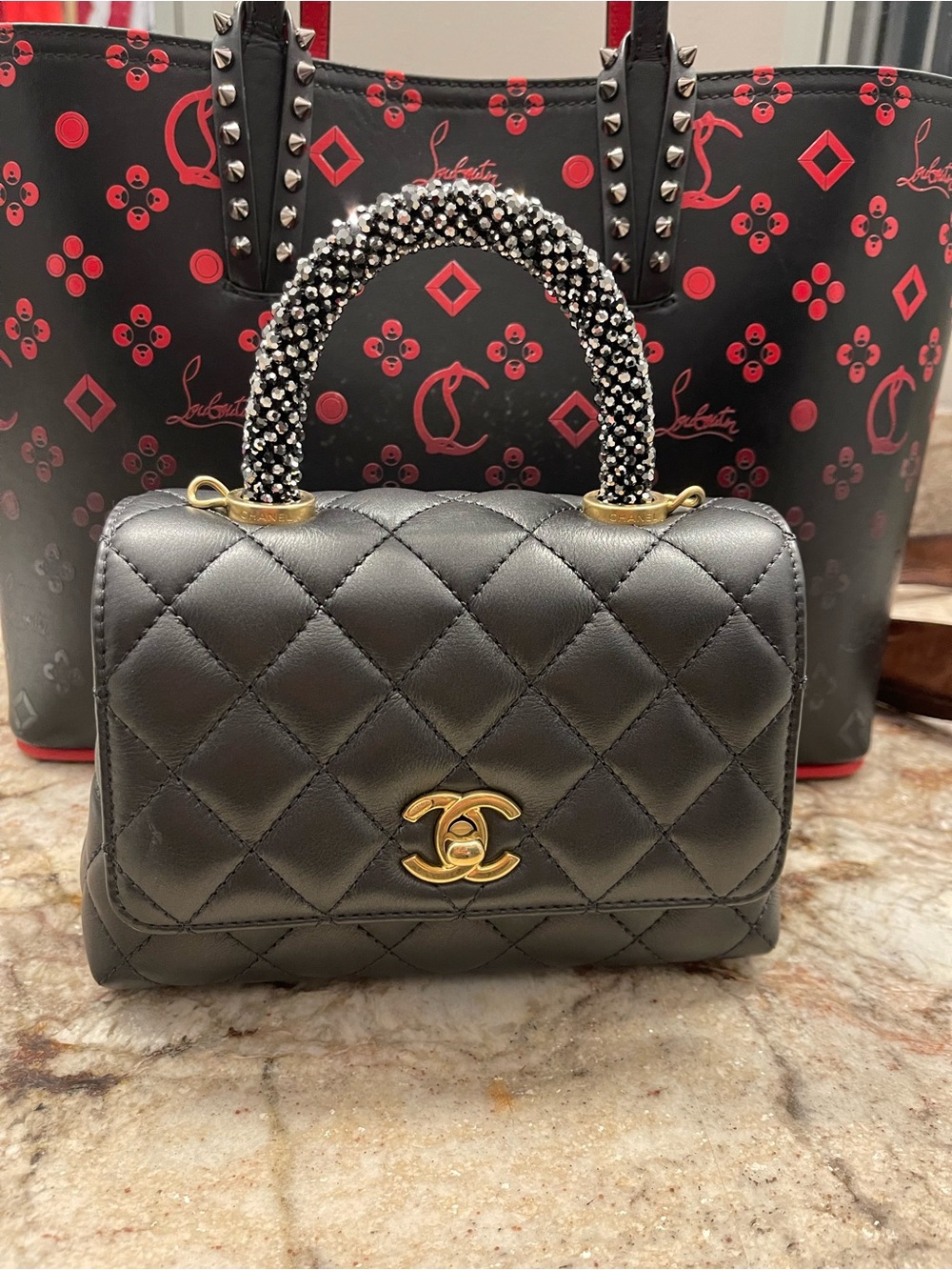 CHANEL Black Quilted Mini Top-Handle Bag with antiqued Gold CC Hardware